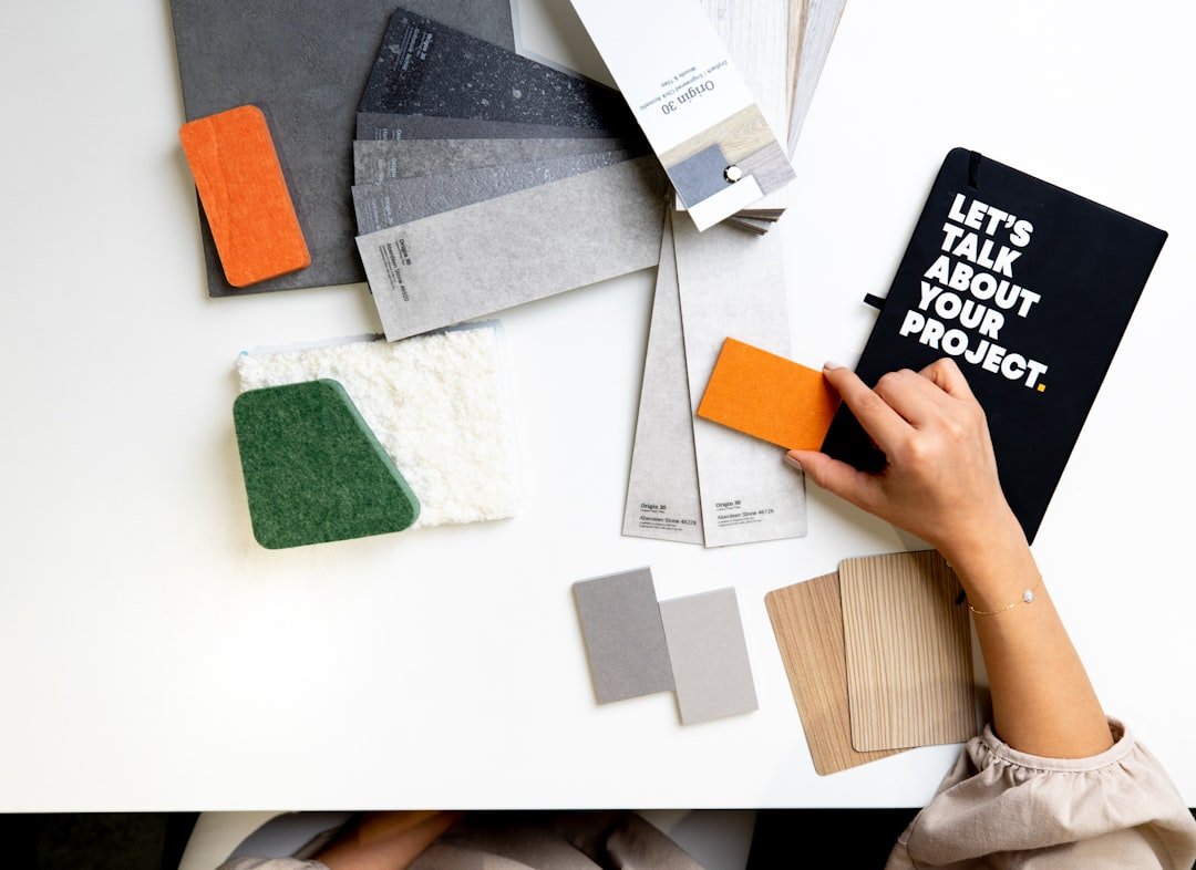 Cohesive interior color palette — photo by Mohammad Lotfian on Unsplash Designer selecting coordinated color and material samples for a cohesive interior palette