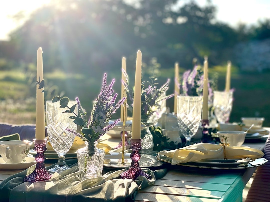 Romantic garden tea party table with flowers and outdoor place settings