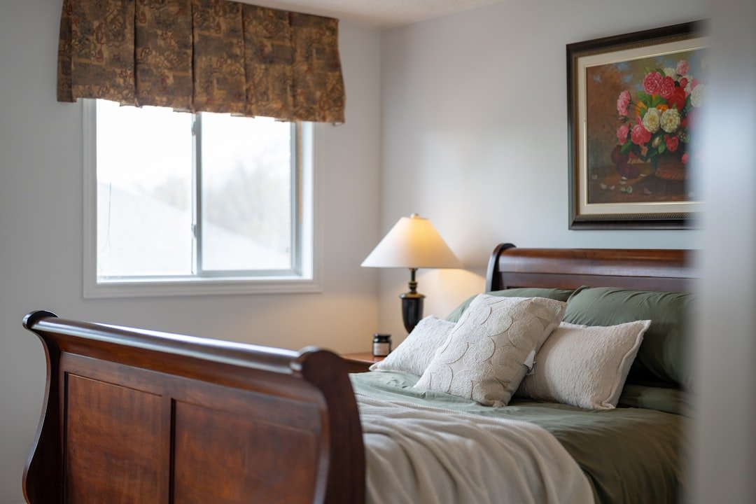 Traditional bedroom with a dark wood sleigh bed, coordinated furniture and warm classic decor