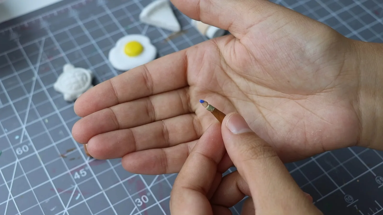 Smoothing and repairing the rim of an air-dry clay clock
