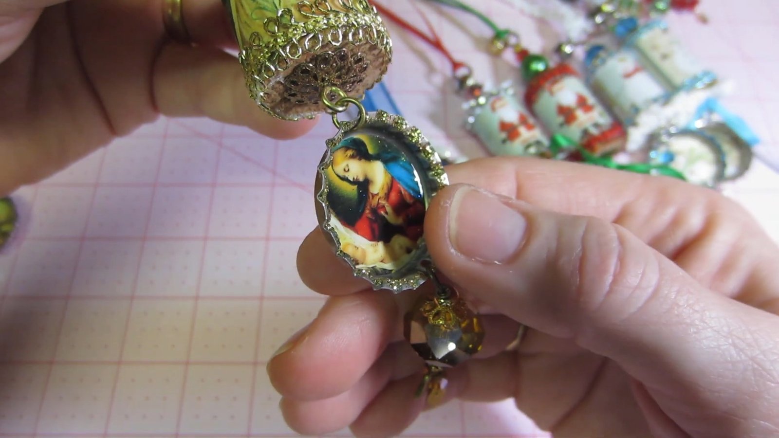 Gold vintage-style cork ornament with a religious picture medallion and bead drop