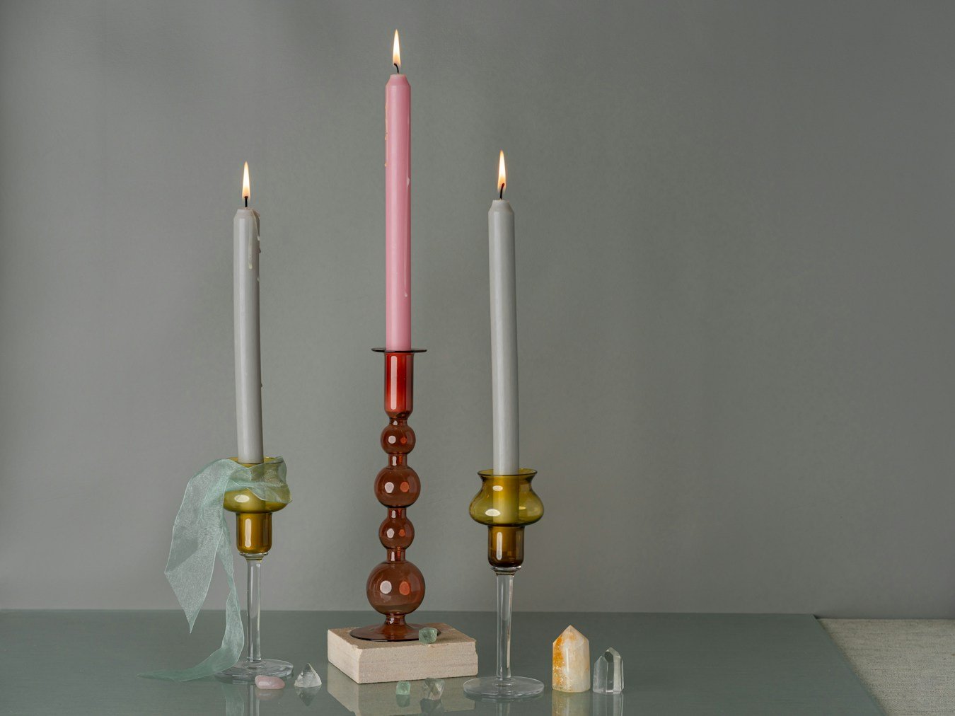 Candles in holders arranged on a table