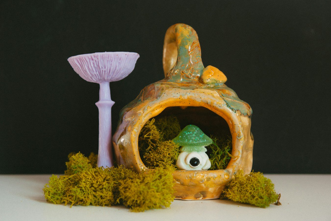 A whimsical decorative mushroom house in a playful vintage style