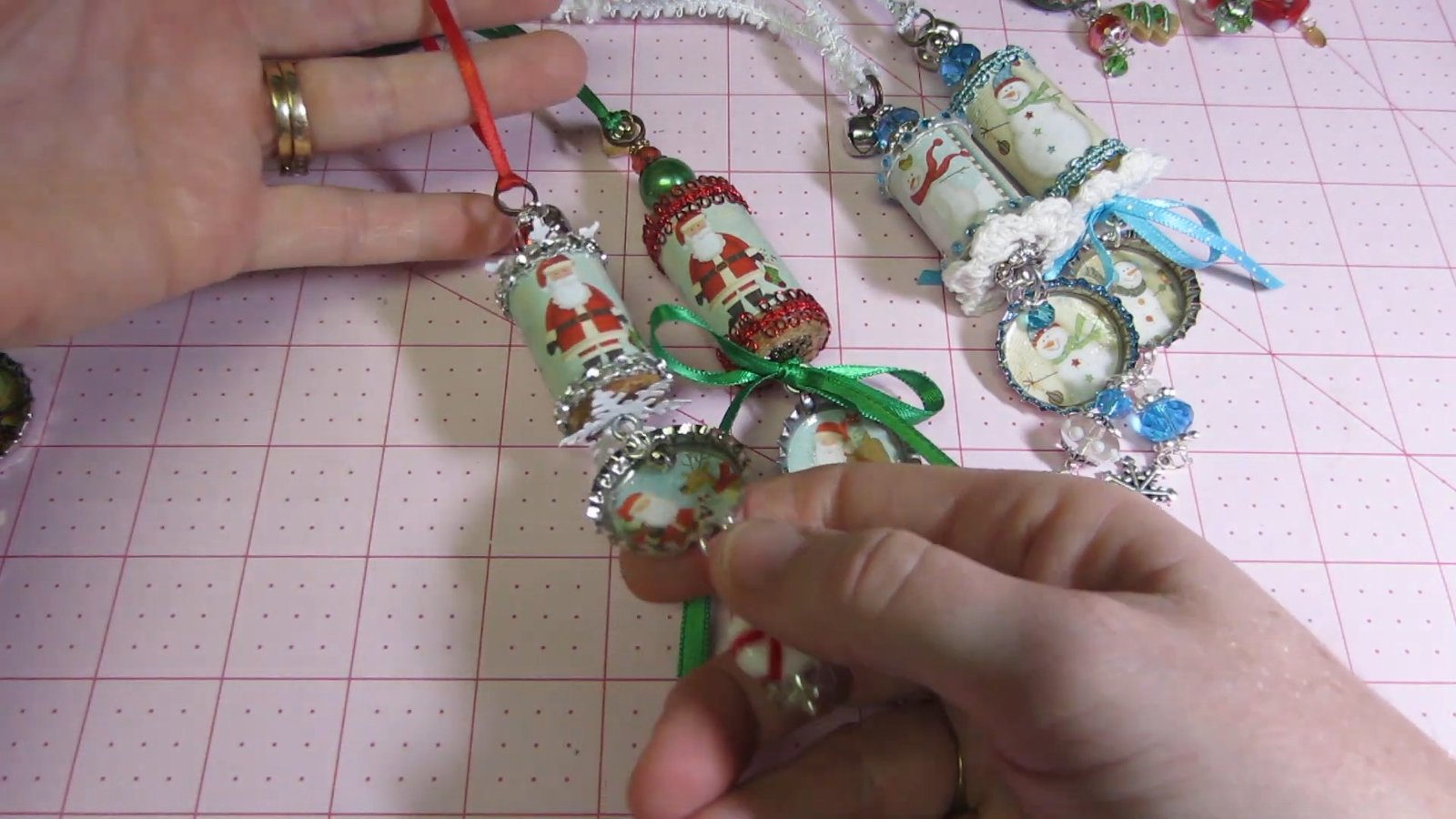 Santa wine cork ornament with green ribbon and a red-accented bottle-cap pendant