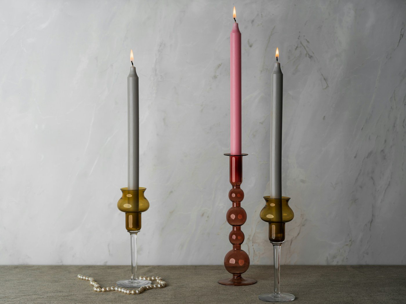 Artful candleholders shown as a tabletop still life