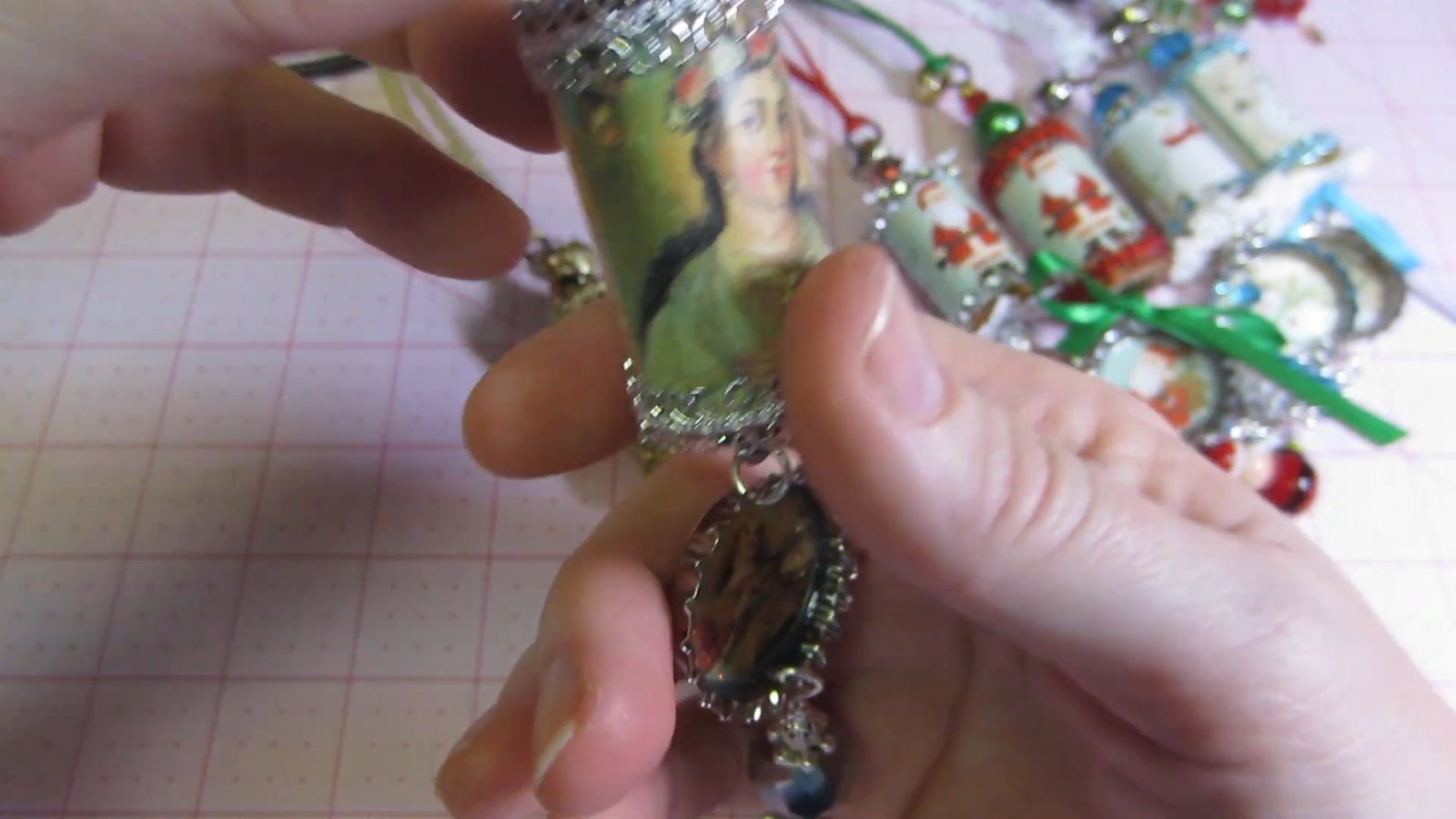Silver-trimmed wine cork ornament with a dark metal bottle-cap medallion